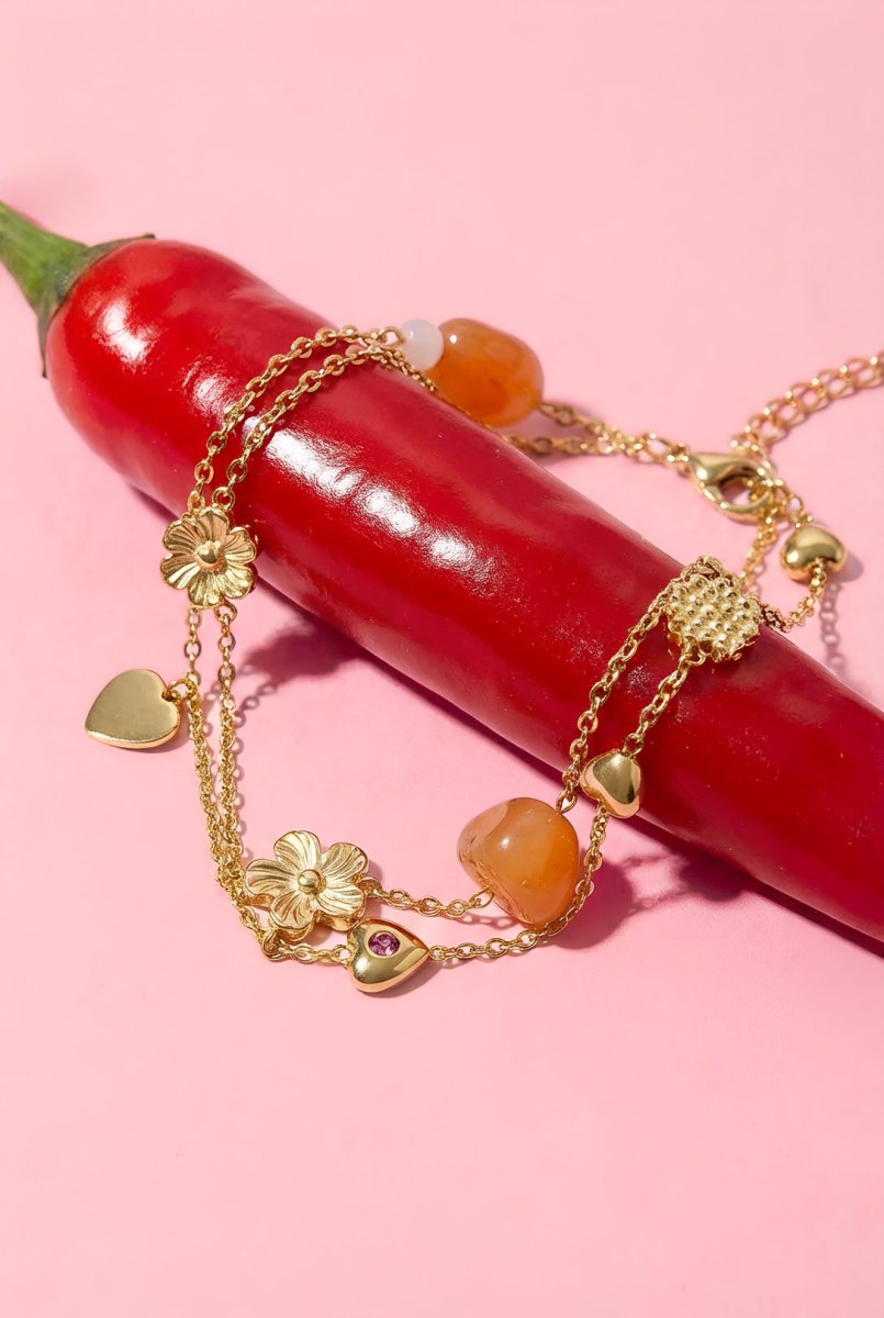 Bedelarmband met oranje kralen, bloemen en hartjesRojaluxe