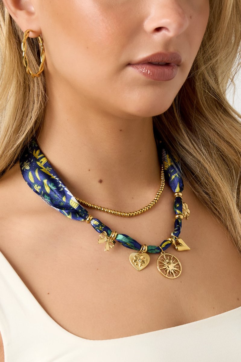 Choker met stoffen band en zon hangerRojaluxe