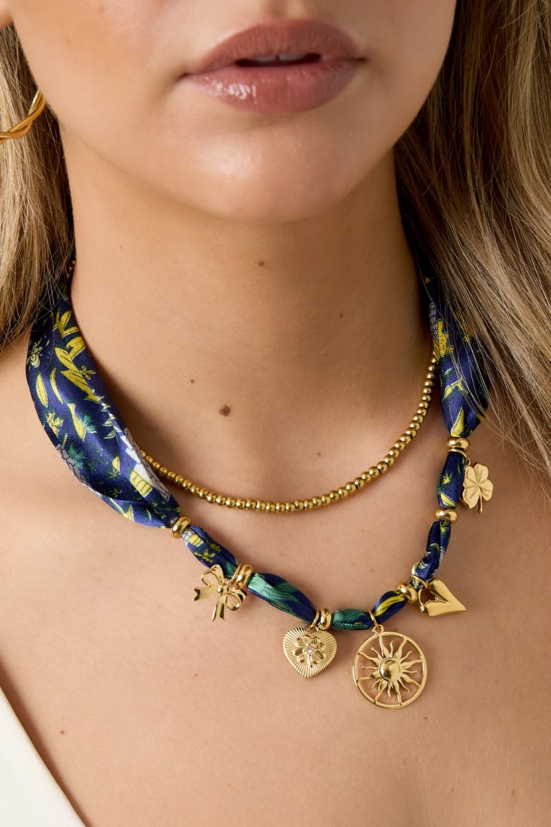 Choker met stoffen band en zon hangerRojaluxe