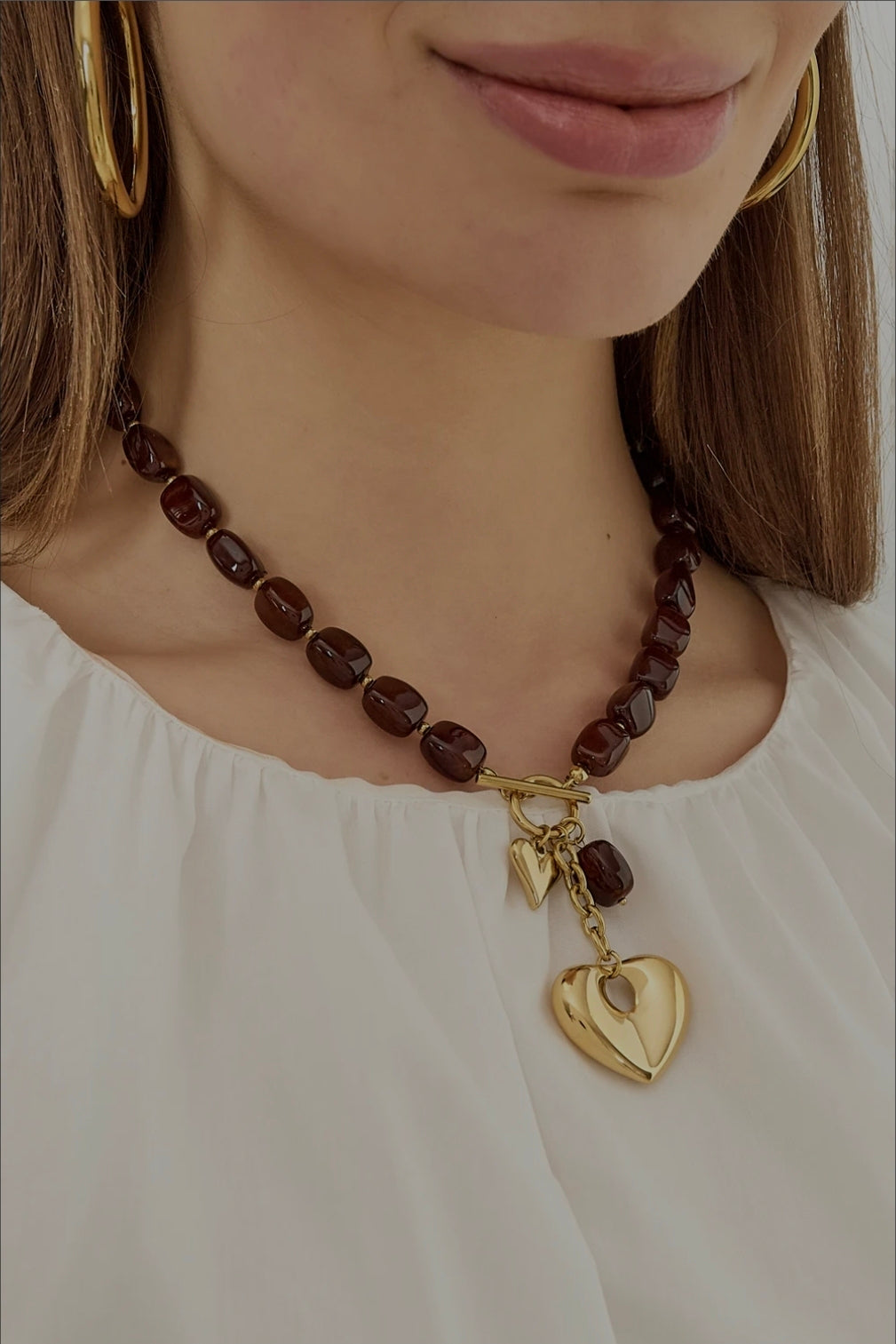 Ketting met kralen en hartbedels